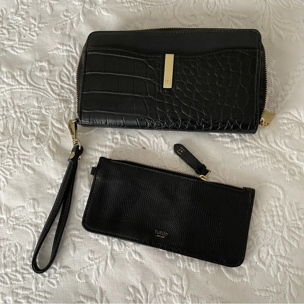 NWOT Tutilo Black wallet with wristlet. Gold hardware. Very nice